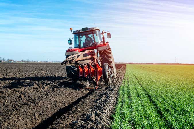 Tractor-agricultural-machine-cultivating-field