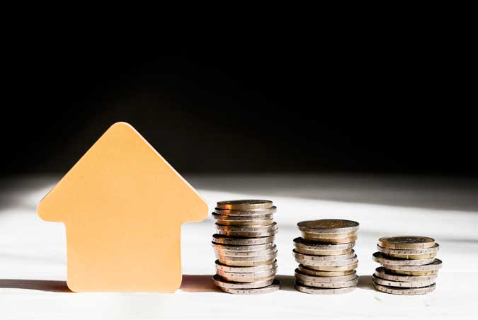 various-piles-coins-arrow-pointing-up