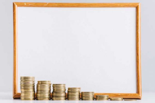 increasing-stacked-coins-front-blank-white-board