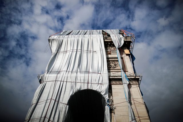Removal of the fully wrapped Arc de Triomphe monument on the Champs Elysees avenue in Paris