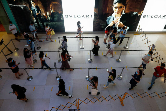 Singapore-People queue for temperature checks