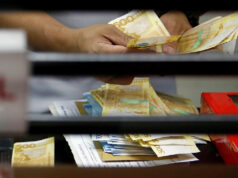 Peso edges up vs dollar ahead of US labor data