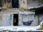 In cold Ukraine village, Banksy mural offers warm bath