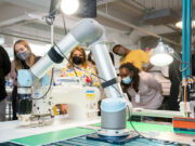Robots set their sights on a new job: sewing blue jeans