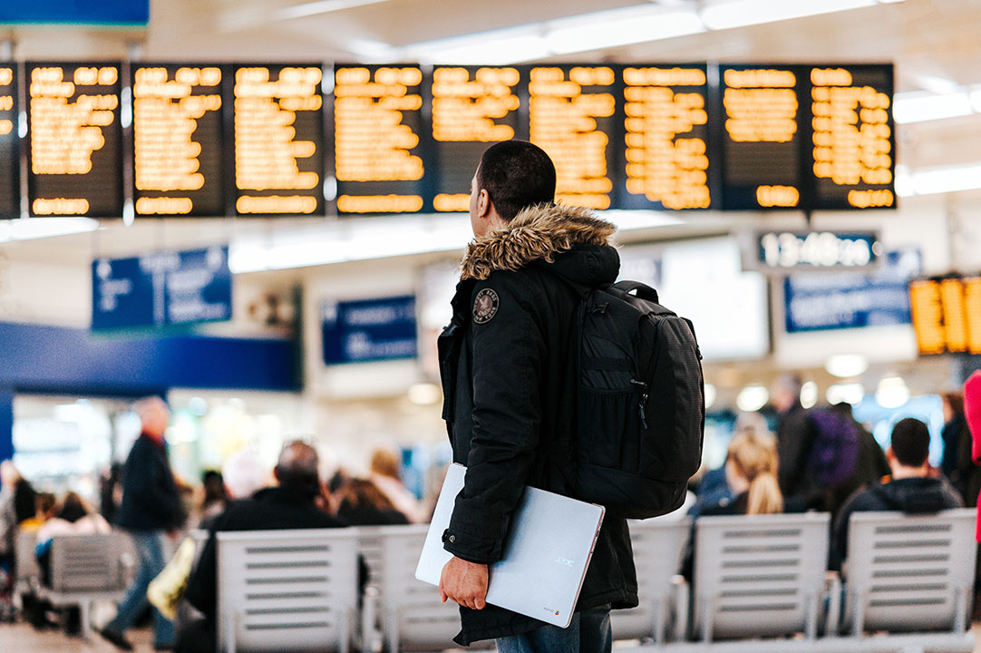 man standing inside airport