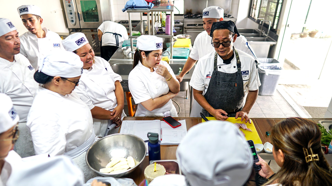 CCA Manila students with a chef instructor at the new campus in BGC