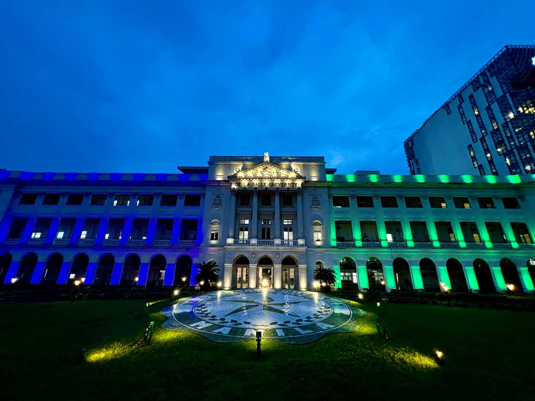 DLSU-lit-up-its-iconic-St.-La-Salle-Building-in-celebration-of-LSEED-Center-and-ACSEnt-partnership