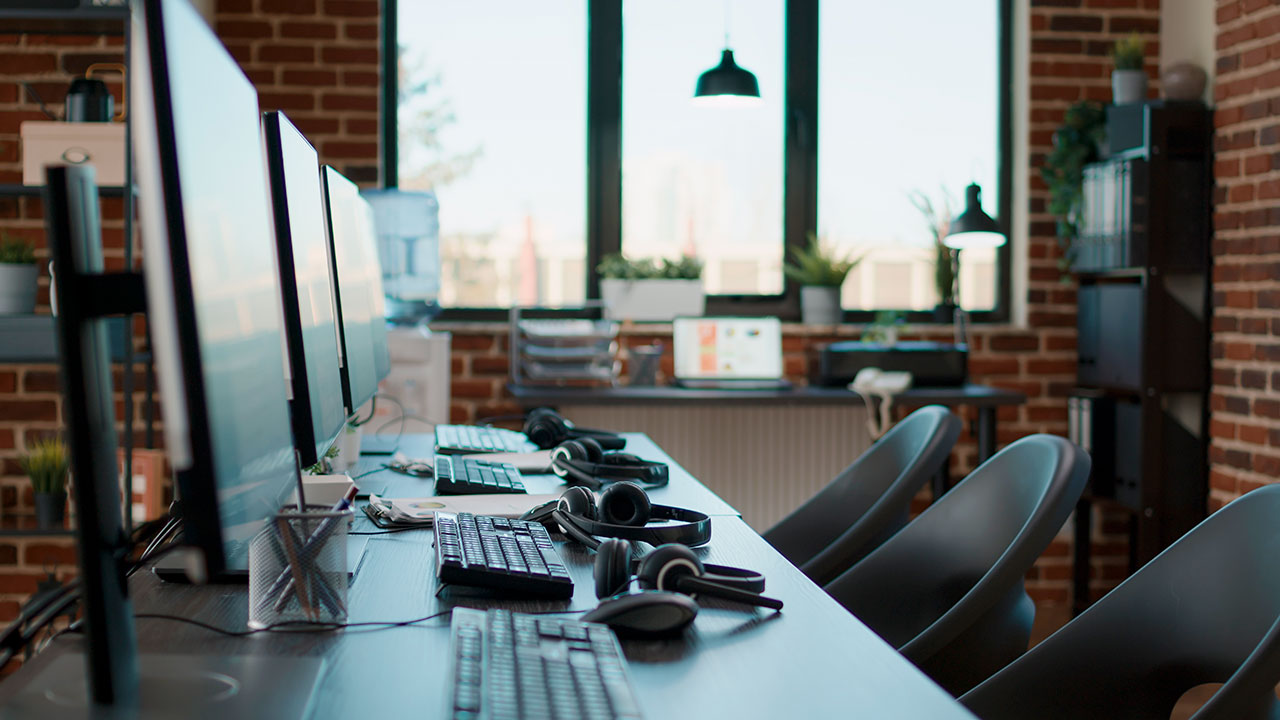 no-people-desk-with-multiple-computers-call-center-office-used-by-telemarketing-agents-answer-phone-calls-helpline-empty-space-with-technology-give-assistance-customer-care
