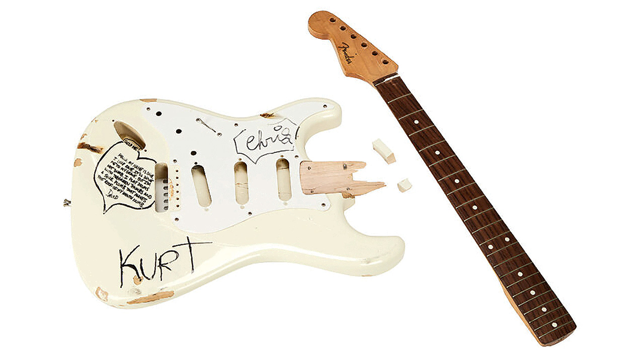 KURT COBAIN STAGE-PLAYED AND SMASHED BAND-SIGNED FENDER STRATOCASTER ELECTRIC GUITAR
