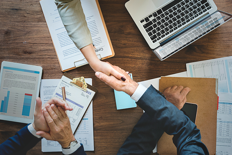business-people-shaking-hands-together-OL