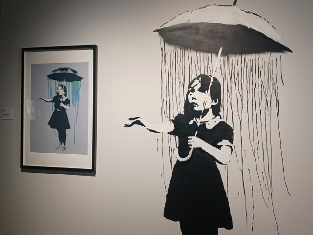 A-screen-print-and-a-reproduction-of-Banksy’s-2008-post-Hurricane-Katrina-mural-“Nola”-in-New-Orleans-