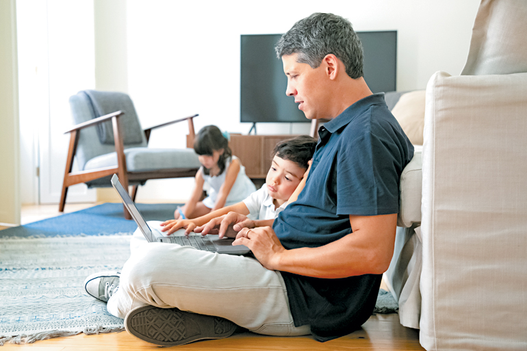SF_focused-dad-little-son-sitting-floort-OL