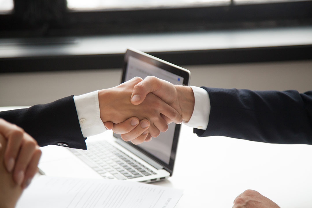 businessman-handshaking-businesswoman