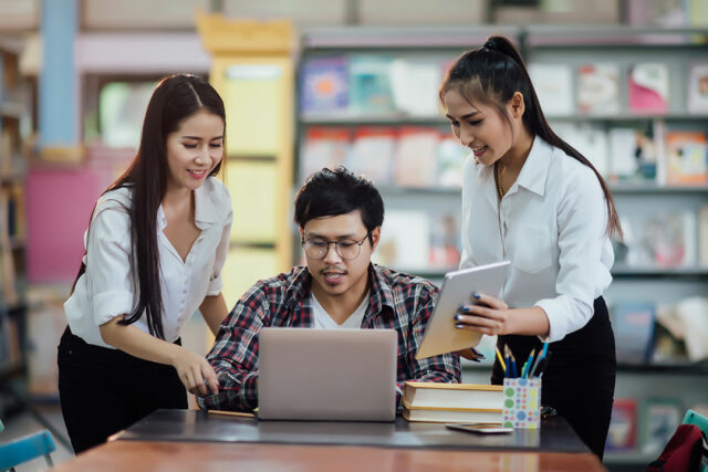 young-students-learning-library-bookshelves