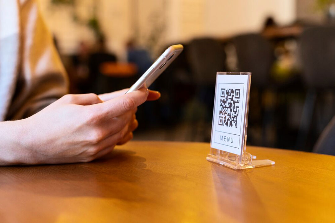 person-scanning-qr-code-wc
