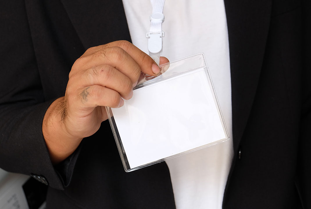 businessman-with-business-concept-holding-white-card