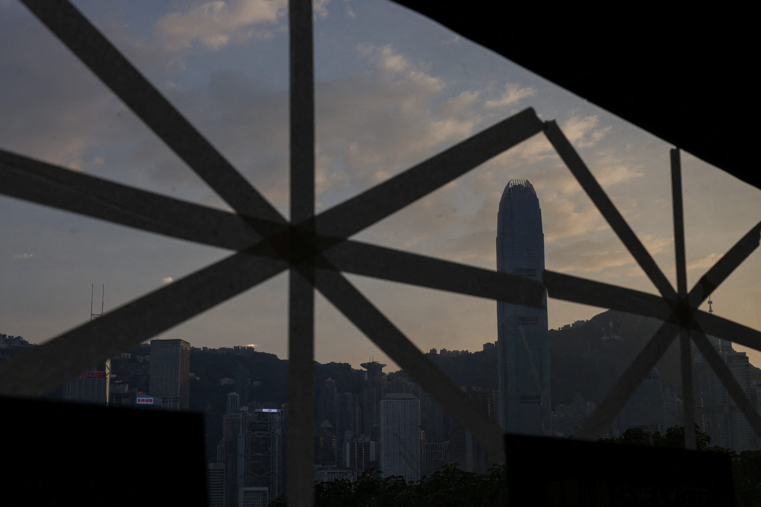 A taped store window stands in preparation for Typhoon Ragasa, with the International Finance Centre in the background, in Hong Kong