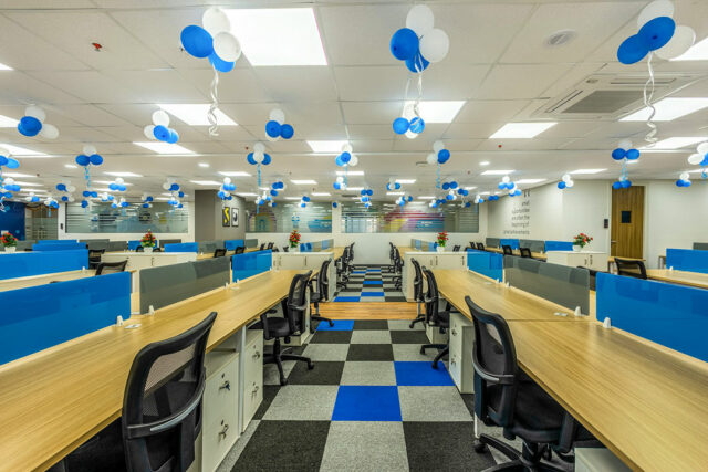a-room-with-a-checkered-floor-and-blue-and-white-decorations