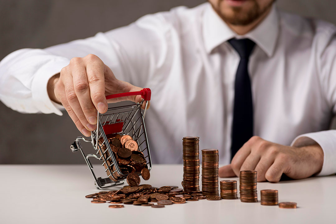 front-view-businessman-spilling-shopping-cart-coins