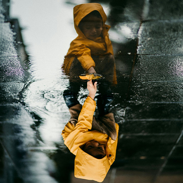 toddler in yellow raincoat