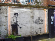 Banksy’s anonymity is what gives — gave? — his art its power